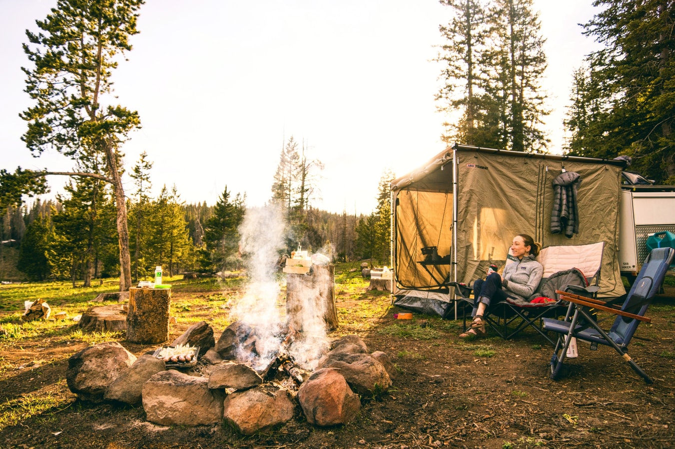 women enjoing nature in camping tent