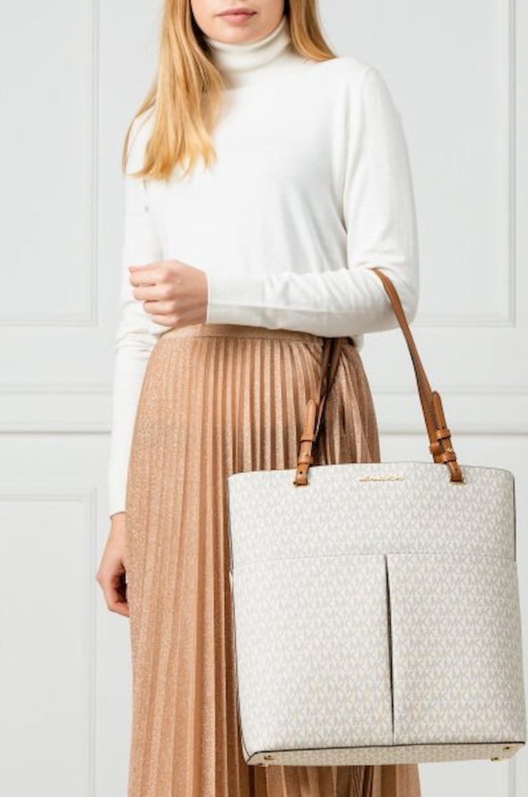 woman wearing leather tote bag