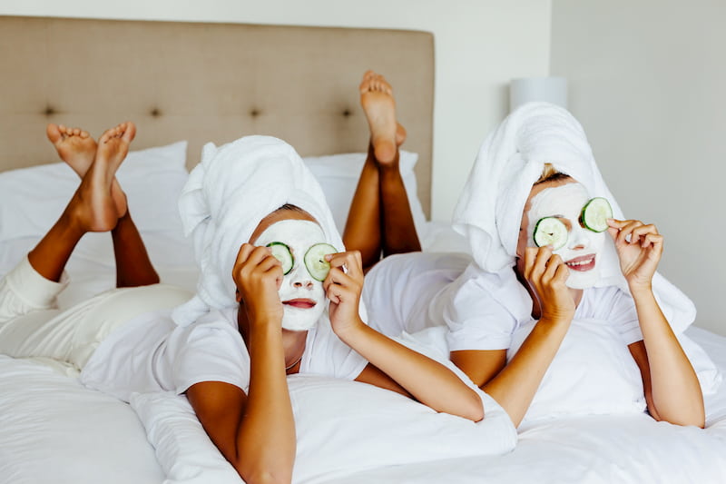 women enjoying with their clay maska on their face