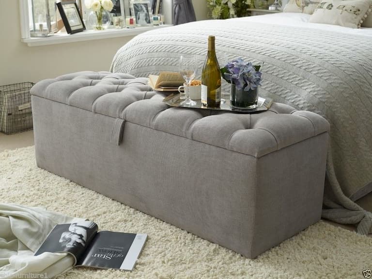 grey ottoman as a storage box for bedroom