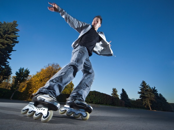 picture of a man with roller skates on the street