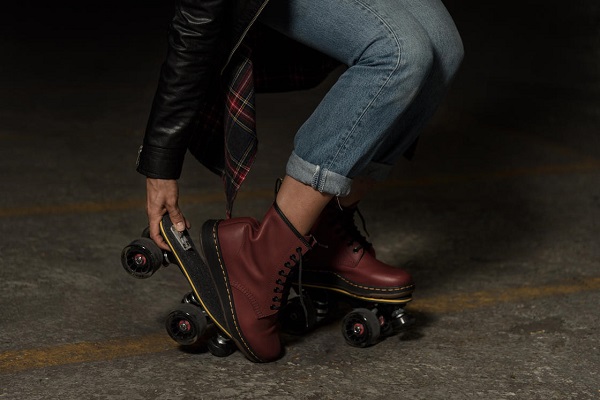 picture of girl in jeans, leather jacket and roller skates