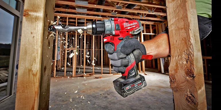 Close-up of working with milwaukee power drill