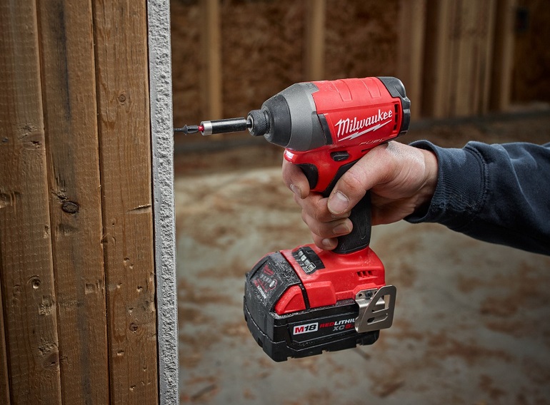 Close-up of working with milwaukee m18 fuel impact driver