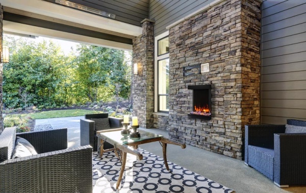 Well designed covered patio boasts stone