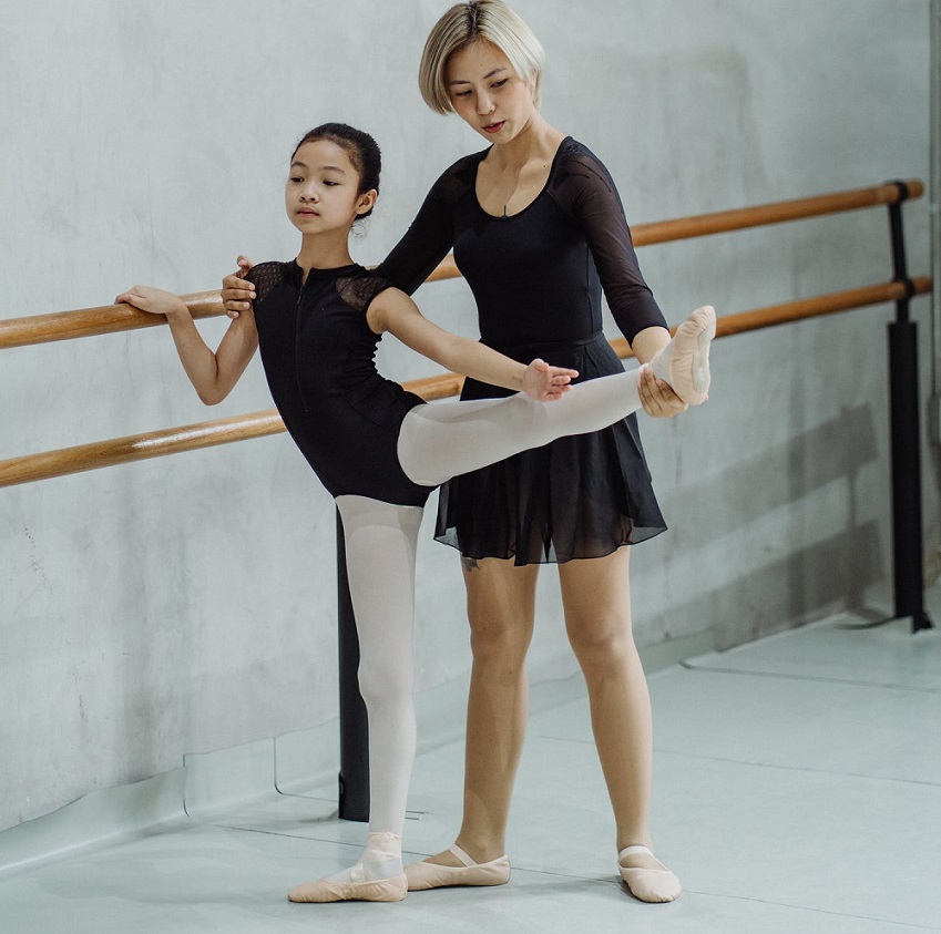 picture of a woman and a little girl dancing ballet in a dance studio