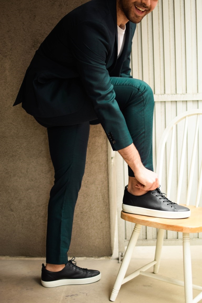 picture of a men wearing green outfit and black ECCO shoes