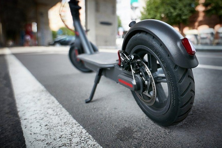 scooter wheels and deck on street