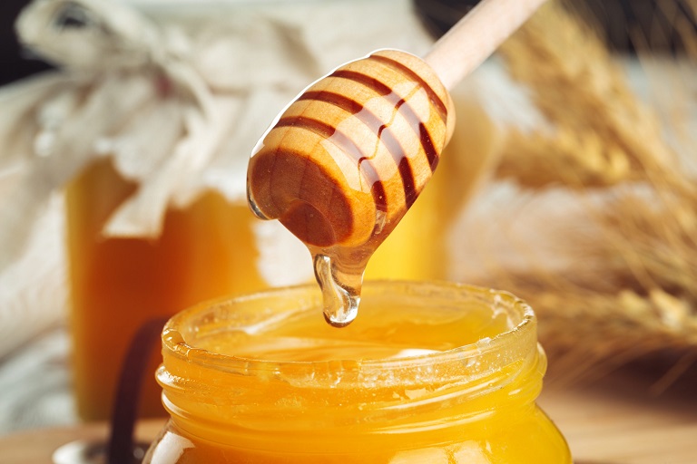 sweet honey in glass jar