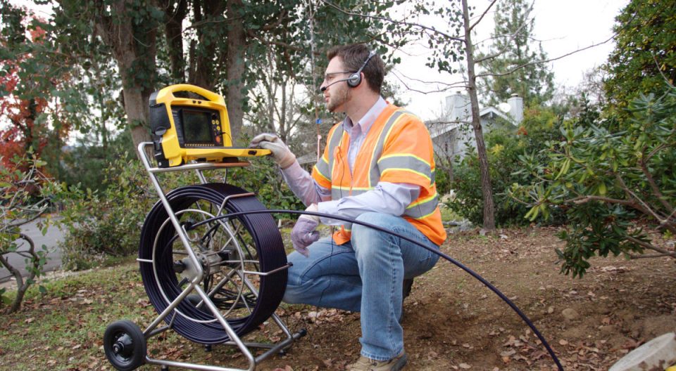 Man working with Pipe Inspection Cameras