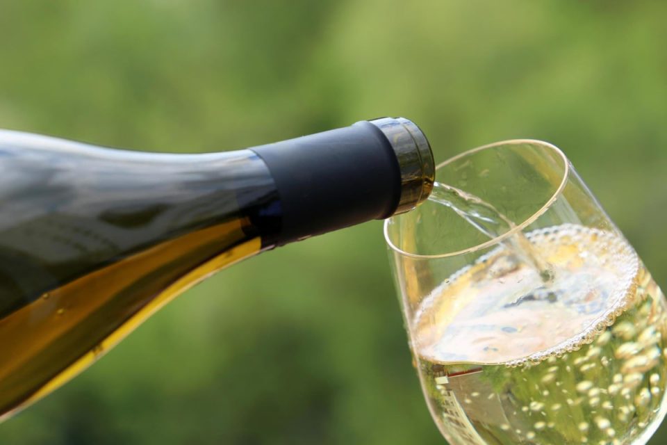 Sipping white a glass of wine