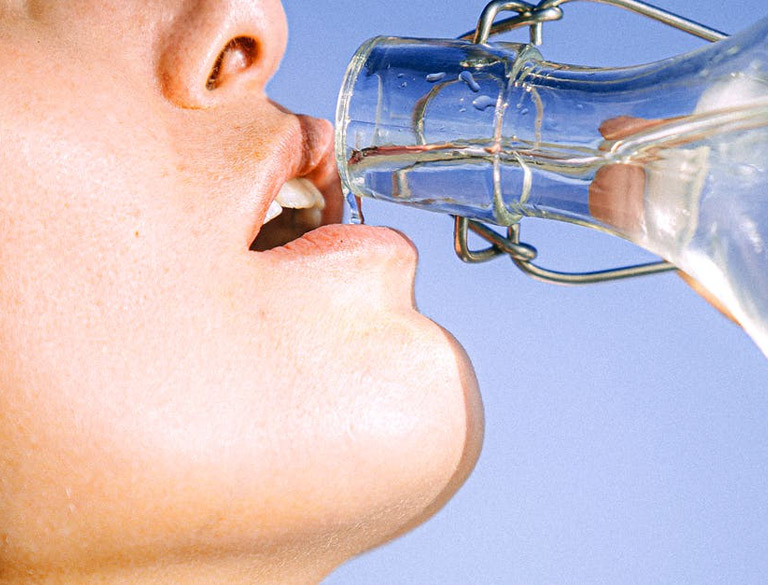 drinking-from-glass-water-bottle