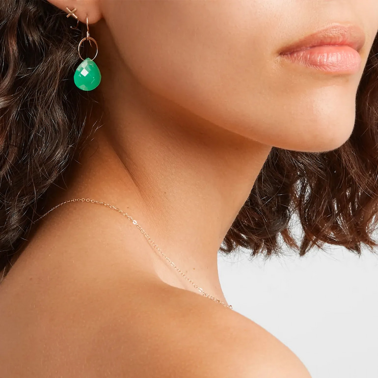 girl with environmentally friendly earrings with turquioise gems