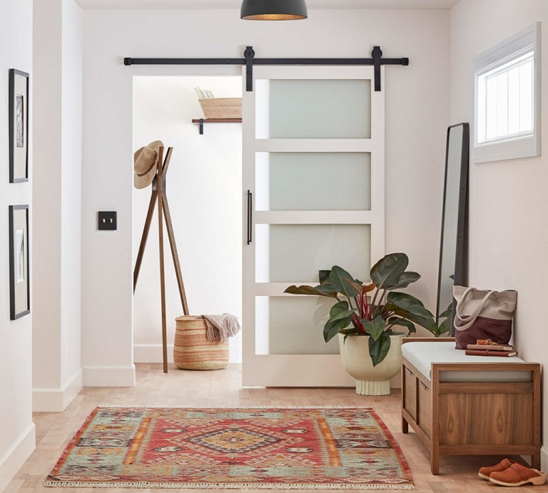 glass sliding barn door in entrance hall