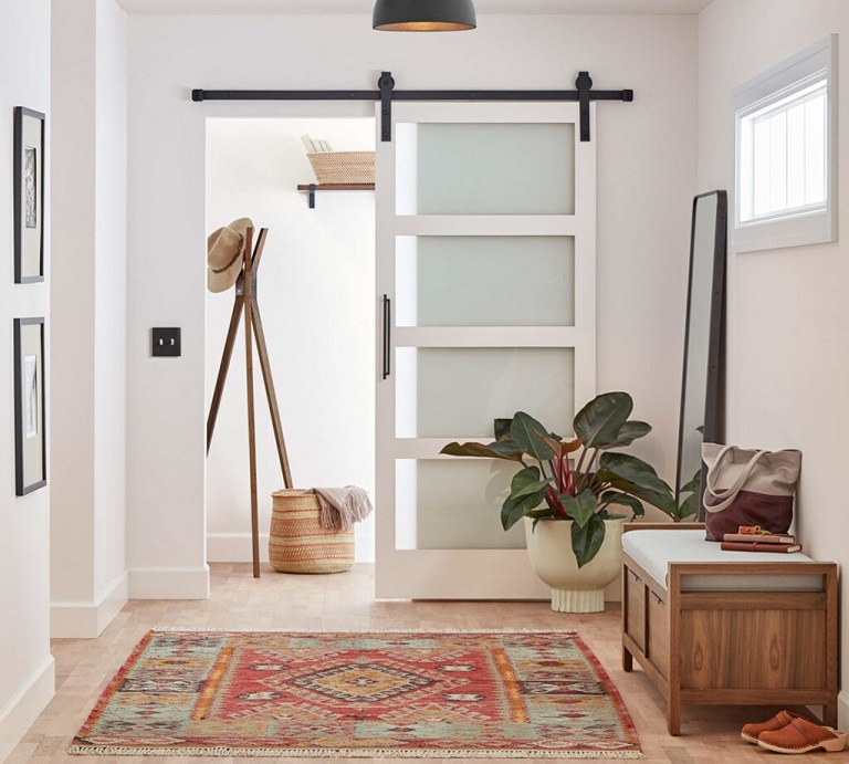 glass sliding barn door in entrance hall 