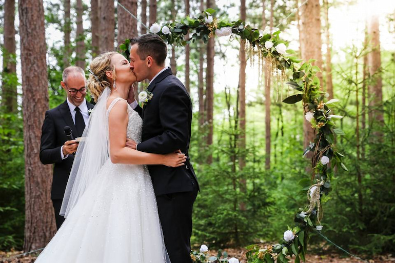 couple kissing on their wedding day