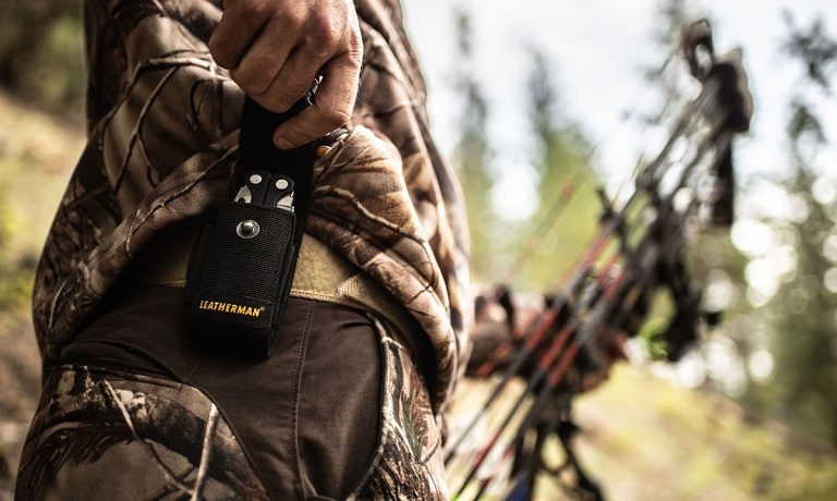 Close-up of multi tool attached on a belt of a hunter