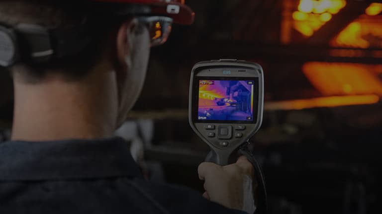 a man photographing with a thermal camera