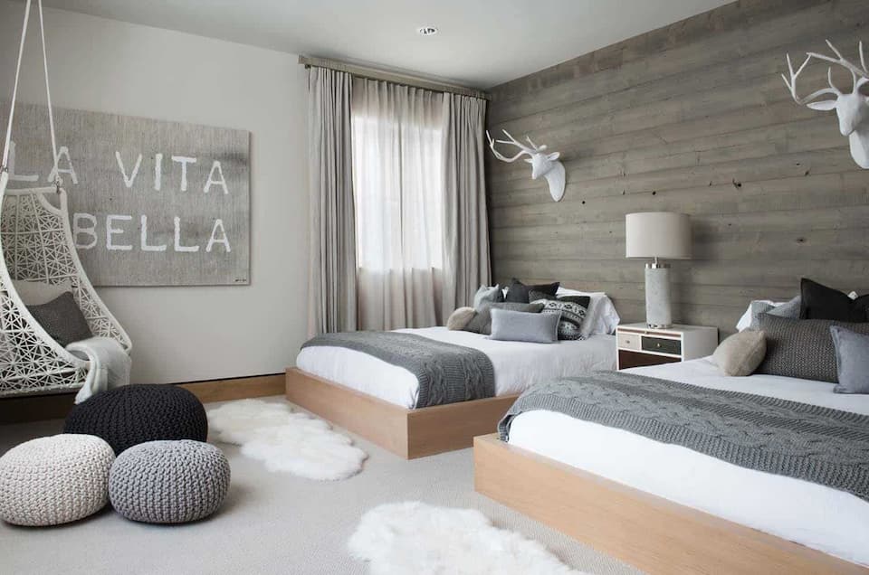 Neutral Scandinavian Bedroom with soft blankets and white caprets
