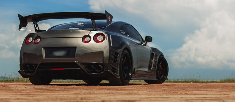 car with a rear spoiler in a dessert