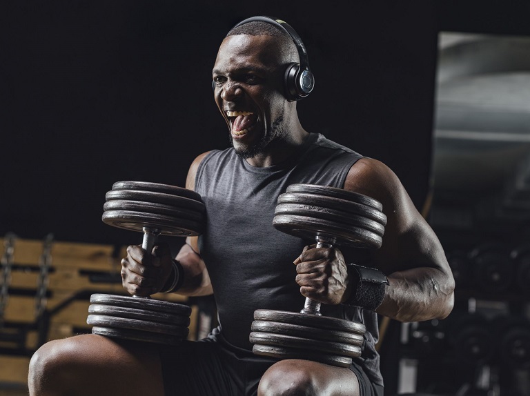 man with his headphones on hyping himself up before a hard set