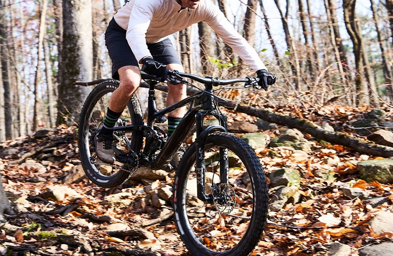 Man riding mountain bike in nature