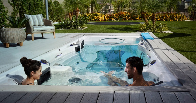 couple enjoy swim spa