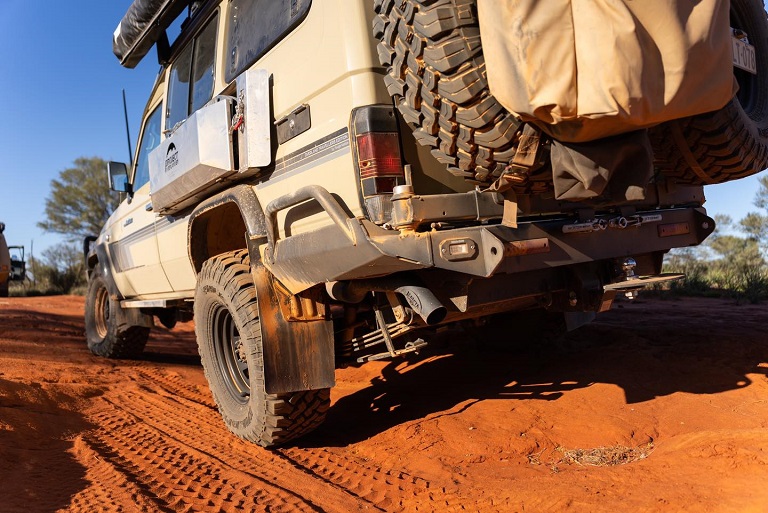 SUV with aftermarket exhaust driven in nature