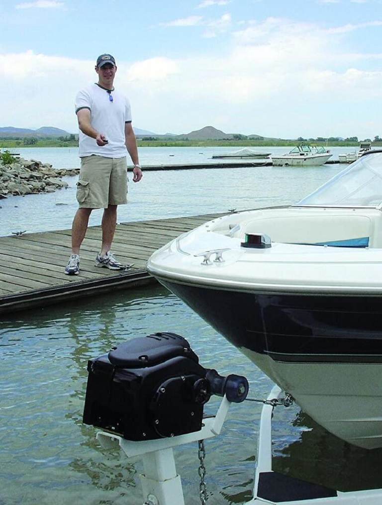 man controlling an electric boat winch