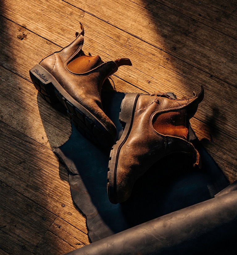 brown Blundstone shoes on the wooden floor
