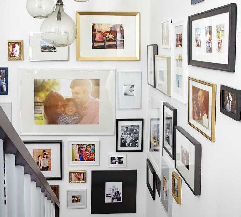 wall display with a lot of photos in different sizes