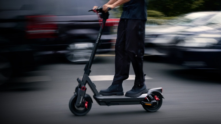 man driving Segway ninebot e-scooter