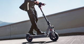 man driving electric scooter